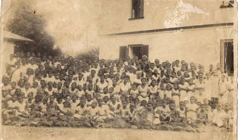..Teacher at Basel Mission Girls School Down Beach (First staff member seated to the right)